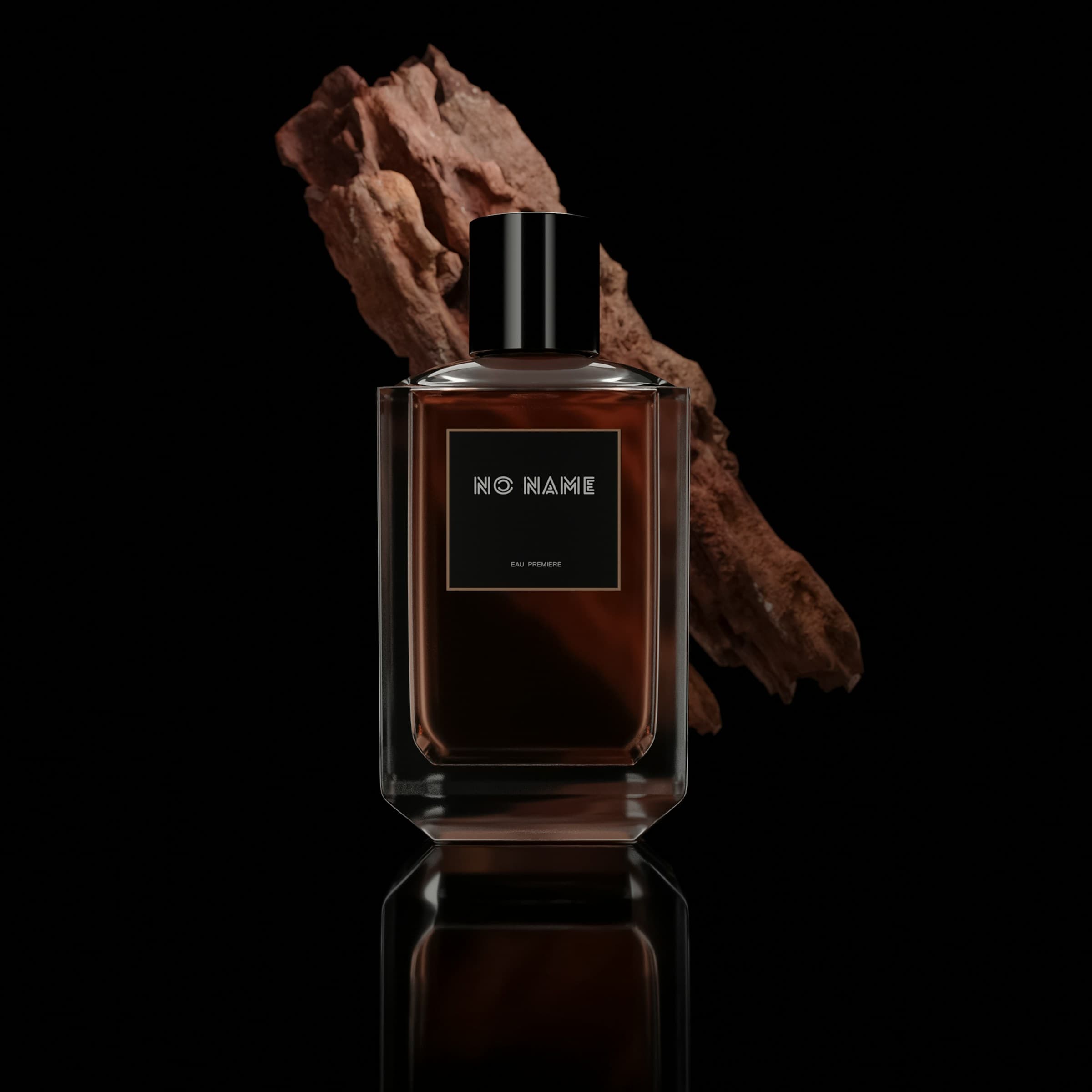 Dark amber perfume flacon beside a raw piece of agarwood on a black reflective surface